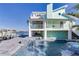 Luxury waterfront home with a beautiful pool and spa at 17410 1St E St, Redington Shores, FL 33708