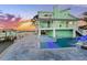 Inviting pool and spa with patio and sunset views at 17410 1St E St, Redington Shores, FL 33708