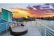 Stunning sunset views from this rooftop deck with circular seating at 17410 1St E St, Redington Shores, FL 33708