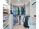 Large walk-in closet with ample shelving and hanging space at 17410 1St E St, Redington Shores, FL 33708