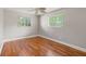 Bright bedroom with hardwood floors and ceiling fan at 1901 Oakdale S Ln, Clearwater, FL 33764