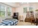 Cozy bedroom with double bed, built-in shelving, and ample natural light at 1919 W Lemon St, Tampa, FL 33606