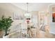 Small dining area with round table and chairs, near entryway at 20388 Lagente Cir, Venice, FL 34293