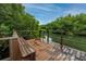 Wooden dock overlooking a tranquil waterway, offering scenic views of lush mangrove trees at 2909 Lichen Ln # A, Clearwater, FL 33760