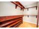 Walk-in closet with wooden shelves and hanging rods at 3610 Pine Knot Dr, Valrico, FL 33596