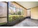 Relaxing screened porch overlooking a lush green backyard at 3610 Pine Knot Dr, Valrico, FL 33596