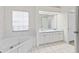 Bathroom boasts a corner bathtub and double vanity at 4109 W Platt St, Tampa, FL 33609