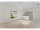 Bright dining room with large window, chandelier, and neutral color palette at 4109 W Platt St, Tampa, FL 33609