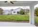 Covered patio overlooking a spacious backyard at 475 Winwood Ct, Port Charlotte, FL 33954