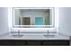 Double vanity bathroom with modern gray cabinets and quartz countertop at 475 Winwood Ct, Port Charlotte, FL 33954