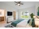 Bright bedroom with ensuite bathroom access, walk-in closet, and backyard view at 475 Winwood Ct, Port Charlotte, FL 33954