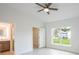 Spacious bedroom with walk-in closet and access to bathroom at 475 Winwood Ct, Port Charlotte, FL 33954