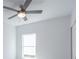 Bedroom with ceiling fan and window overlooking backyard at 475 Winwood Ct, Port Charlotte, FL 33954