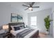 Comfortable bedroom featuring a large bed, nightstands, and artwork at 475 Winwood Ct, Port Charlotte, FL 33954