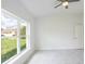 Bright bedroom with large window and backyard view at 475 Winwood Ct, Port Charlotte, FL 33954