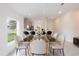 Elegant dining room with a glass table and modern chairs at 475 Winwood Ct, Port Charlotte, FL 33954
