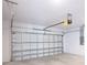 Garage with automatic door opener and ample space for parking and storage at 475 Winwood Ct, Port Charlotte, FL 33954
