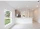 Bright and airy living room with tile flooring and sliding glass doors at 475 Winwood Ct, Port Charlotte, FL 33954