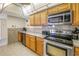 Kitchen with stainless steel appliances and wood cabinetry at 6287 Bahia Del Mar Cir # 603, St Petersburg, FL 33715