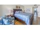 Main bedroom features wood floors, a king bed and decorative furnishings at 6287 Bahia Del Mar Cir # 603, St Petersburg, FL 33715