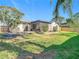 Private backyard oasis, features a screened patio and pond at 652 Timber Bay W Cir, Oldsmar, FL 34677