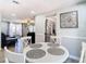 Cozy dining area with round table, white chairs, and built-in shelving at 652 Timber Bay W Cir, Oldsmar, FL 34677