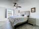 Main bedroom with ceiling fan and hardwood floors at 652 Timber Bay W Cir, Oldsmar, FL 34677