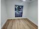 Bright bedroom with large window and wood floor at 7007 Oakview Cir, Tampa, FL 33634