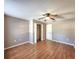 Spacious bedroom with wood floors and a ceiling fan at 7805 Pine Trace Dr, Sarasota, FL 34243