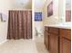 Clean bathroom with double vanity and shower/tub combo at 8423 Blue Rock Dr, New Port Richey, FL 34653