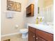 Clean bathroom with vanity, toilet and shower at 8423 Blue Rock Dr, New Port Richey, FL 34653