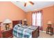 Bedroom with a double bed, nightstands, and window at 8423 Blue Rock Dr, New Port Richey, FL 34653