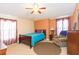 Cozy bedroom with a double bed, nightstand, and armchair at 8423 Blue Rock Dr, New Port Richey, FL 34653