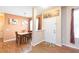 Dining area with wood floors and an adjacent entryway at 8423 Blue Rock Dr, New Port Richey, FL 34653