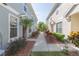 Townhouse community with landscaped walkway at 8423 Blue Rock Dr, New Port Richey, FL 34653