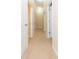 Bright hallway with neutral walls and carpeted floor at 8423 Blue Rock Dr, New Port Richey, FL 34653