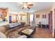 Living room with sectional sofa and hardwood floors at 8423 Blue Rock Dr, New Port Richey, FL 34653