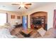 Spacious living room featuring a large sectional sofa and built-in entertainment center at 8423 Blue Rock Dr, New Port Richey, FL 34653