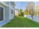 Landscaped side yard with privacy fence at 8423 Blue Rock Dr, New Port Richey, FL 34653