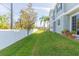 Landscaped side yard with privacy fence at 8423 Blue Rock Dr, New Port Richey, FL 34653