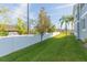 Landscaped side yard with privacy fence at 8423 Blue Rock Dr, New Port Richey, FL 34653