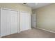 Bedroom featuring double door closet and neutral carpeting at 1012 Tuscanny St, Brandon, FL 33511