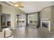 Living room with tile floors, fireplace, and sliding doors to the patio at 1012 Tuscanny St, Brandon, FL 33511