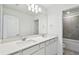 Bright bathroom offers double sinks, modern lighting, and spacious layout at 10320 Cross River Trl, Parrish, FL 34219