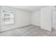 Clean bedroom with soft carpet, a sunny window, and flexible open space at 10320 Cross River Trl, Parrish, FL 34219