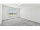 Bright bedroom offers neutral carpet, ample natural light, and a serene atmosphere at 10320 Cross River Trl, Parrish, FL 34219