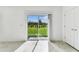 Sliding glass doors opening to spacious backyard with lush green grass at 10328 Cross River Trl, Parrish, FL 34219
