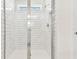 Modern bathroom with glass-enclosed shower and white subway tile at 10328 Cross River Trl, Parrish, FL 34219