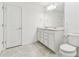 Clean bathroom with double vanity, tile flooring, and modern fixtures at 10328 Cross River Trl, Parrish, FL 34219