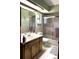 Clean bathroom with a shower/tub combo and wood vanity at 11253 Leland St, Spring Hill, FL 34609